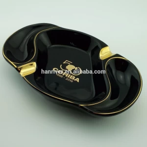 Best selling oval cigar ceramic ashtray with two golden rest with golden edge with customized golden logo for sale