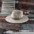 Import fashion belt panama hat decorated shell outdoor sun protection paper braid straw fedora hat wide brim from China