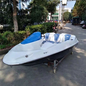 15ft blue speed boat with ski pole