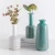 Import Green jade color crackle glaze home decor porcelain flower vases / embossed surface antique decorative ceramic vase from China