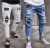 Import SS0006 Men&#039;s new hip hop high-end tight-fitting badges slim hole jeans from China