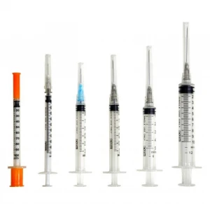 Disposable syringes with needles