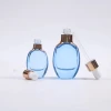 Factory Wholesale 15ml 30ml Luxury Thick Clear Blue Glass Essential Oil Dropper Bottle with Gold Aluminum Cap