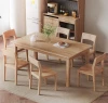 Nordic solid wood dining table and chairs set for small households.