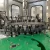 Import Automatic Vodka brandy whisky wine filling and labeling machine from China
