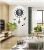 Import Musical Note Decoration Wall Clock Density board Designing Home Decoration Black And White Clock For Living Room from China