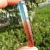 Import New products blue aura quartz crystal wand red titanium aura quartz crystal point from China