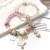 Import pink cat-eye stone natural stone powder crystal dancing girl flower mushroom star multi-element hand-chain hand string from China