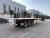 Import Flatbed Truck Trailer Load Capacity Trailer Flatbed 40ft Tri Axle Flatbed Container Semi Trailer from China
