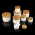 Import 2019 popular white PP plastic cosmetic cream jar 10g 20g 30g 50g 100g 150g 200g plastic jar with bamboo lid from China
