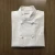 Import hot selling high quality restaurant uniform kitchen cooking black/white chef coat with knot button from China