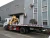 Import Road recovery Howo flatbed wrecker towing truck with folding 3T crane for sale from China