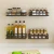 Import Black paint punch free installation stainless steel wall hanging spice rack multi sizes spice bottle organizer from China