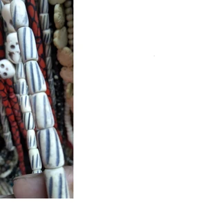 hand carved bone beads in white suitable for jewelry designers