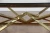 Modern glass top polished stainless steel base coffee table gold