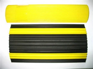 yellow & black rubber speed bump