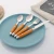 Import 24 piece hanging flatware set with rack,Dinner knife fork spoon stain cutlery set with PP plastic handle wood color from China