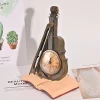 Low moq stone powder resin custom violin shape clock figurine with clocks