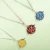 Import Stainless steel hollow flower shape cage diffuser pendant necklace from China