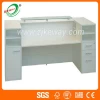 White wooden reception counter with top glasses