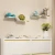 Import Post modern simple creative living room bedroom wall shelf stainless steel decoration storage wall rack  wall shelf from China
