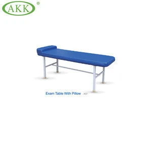 Steel hospital medical patient exam table, examination bed with a pillow, medical treatment table