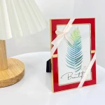 Hot Selling Small Gold Red Color Metal Wall Decoration Photo Frame With Christmas Knot