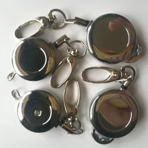 metal badge roller clip with a small ring at top