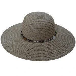 white paper floppy hat with shell belt