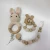 Import Adorable beechwood crochet baby wooden rattle bunny teether with bracelet clip set from China