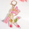 Butterfly fringe dried flower alphabet keychain personalized flower resin initial keychain at the most competitive price