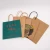 Import high quality 100 pcs/bag 5.25x3.75x8 Inches Small Handles Paper Shopping Bags Kraft Party Brown Bag from China
