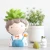 Import Nordic green plant decoration simulation plant decoration potted cartoon boy resin flower pot decoration from China