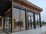 Outdoor sunshine room, electric curtains and porcelain slab door