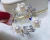 Import Korean-style ladies&#39; elegant temperament flower wheel freshwater pearl brooch high-grade shell brooch from China