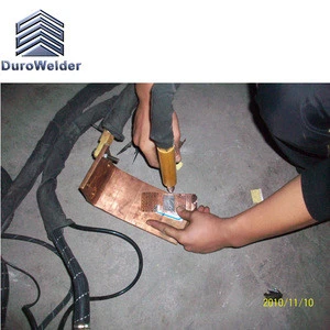 Movable hand-held spot welder for plate