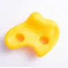 yellow rock climbing hold clips for children adventure park
