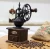 Import Retro style antique logs base manual hand coffee bean grinder cast iron coffee grinder from China