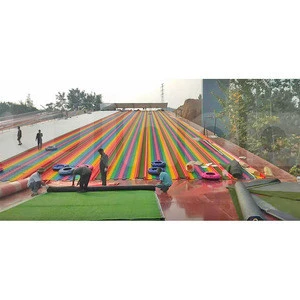 indoor snowboard snow ski slopes simulator attraction artificial ski surface endless rainbow dry slopes