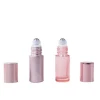 Luxury 5 6 8 10 15 ml empty essential oil round pink packaging cosmetic lip oil perfume bottles roller ball