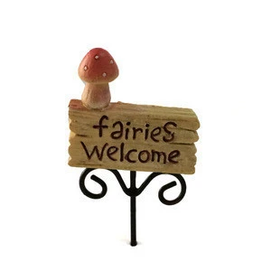 Miniature fairy garden welcome board.