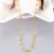 Import Simple 316L Stainless Steel Gold Flower Pattern Lip Chain Necklace Titanium Steel Lines Pattern Lip Choker Necklace Jewelry from China