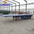 Import 3 Axles 40ft Blue Cheap Flat Bed Semi Trailers Used Flatbed Container Trailer For Sale from China