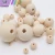 Import Natural uhfinished wooden loose beads round original wooden beads with little holes from China