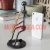 Import Wholesale metal handmade 3D figurine man crafts single pen holders and metal home themed decoration for music gift from China