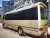 Import 7 meters tourist vehicles Japan LHD bus Low price luxury coach used coaster bus 30 seats from China
