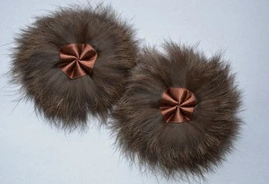 An accessory ("flower") made of rabbit fur for shoe and clothes decoration