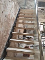 floating stairs with wooden tread and frameless glass railings