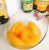 Import Canned food factory OEM fresh fruit  tin canned halves yellow peaches in syrup from China