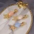 Import CLARMER  Fashion Luxury Starfish Hair Clips Hair Accessories Metal Golden Stone Hair Clip For Women from China